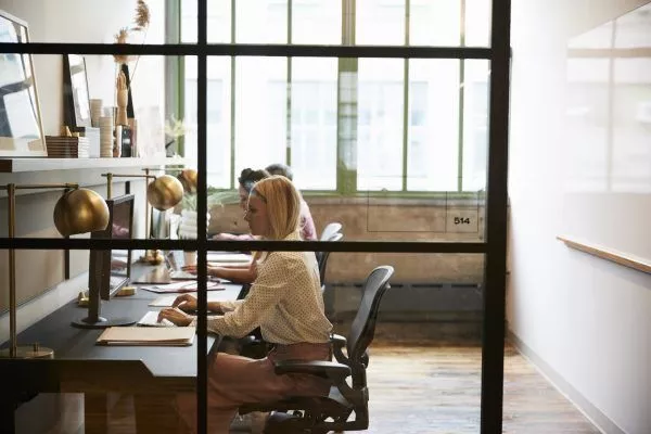 business team working in an office booth close up